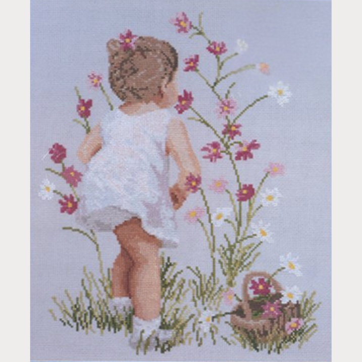 Kit de punto de cruz de Janlynn de una niña recolectando flores silvestres en el campo