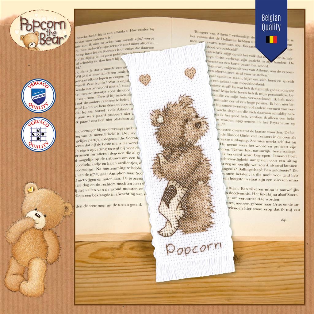 Kit punto de cruz marcapáginas Popcorn the Bear de Vervaco ambientado con libro abierto