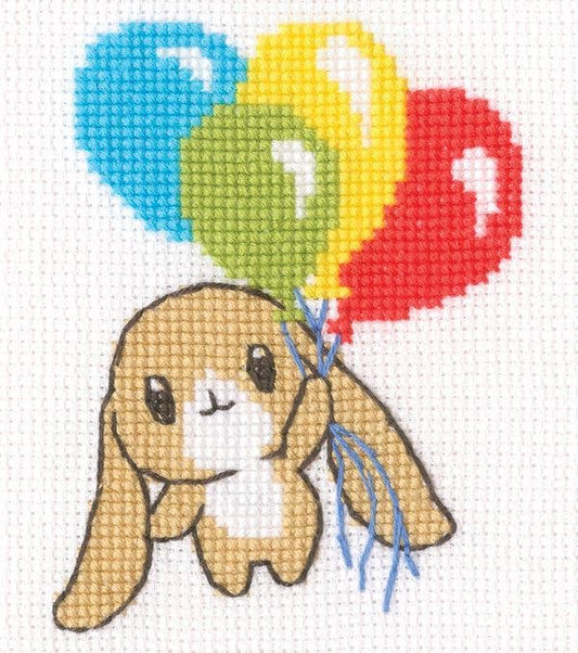Kit de punto de cruz infantil RTO "Conejito con Globos" con conejito sujetando globos de colores. Incluye tela, hilos DMC, aguja e instrucciones.