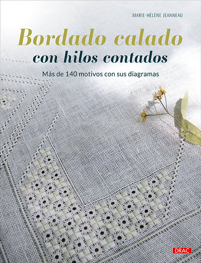Libro Bordado Calado con Hilos Contados de Marie-Hélène Jeanneau: portada con un mantel de bordado blanco calado sobre lino claro