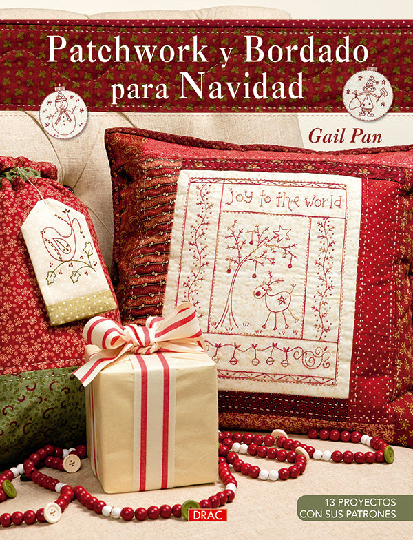 Libro Patchwork y Bordado para Navidad de Gail Pan: portada con un cojín bordado con un reno y telas navideñas en rojo y crema
