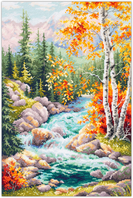 Bordado en punto de cruz de un paisaje de otoño en el bosque con un caudaloso rio y una cordillera al fondo
