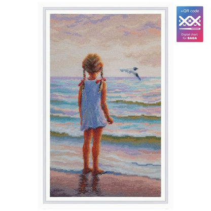 Kit de punto de cruz RTO "Niña y el Mar ¿Dónde están los delfines?" con niña mirando el mar. Incluye tela Zweigart, hilos DMC, aguja e instrucciones.