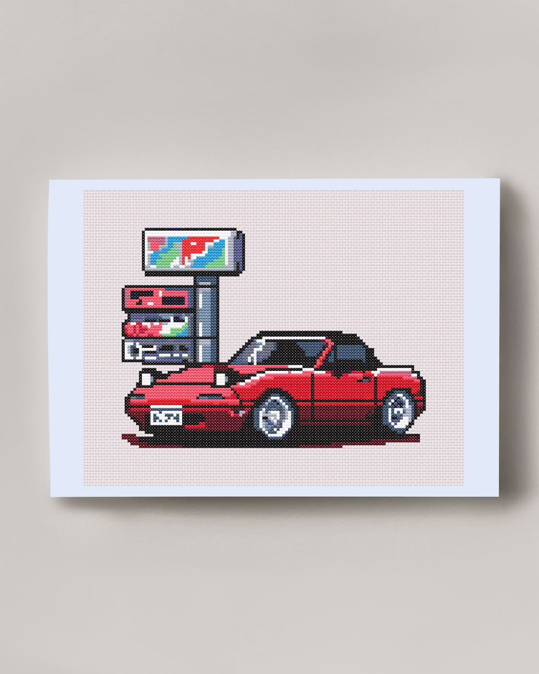 Patrón de punto de cruz de un Mazda Miata estílo JDM en una gasolinera