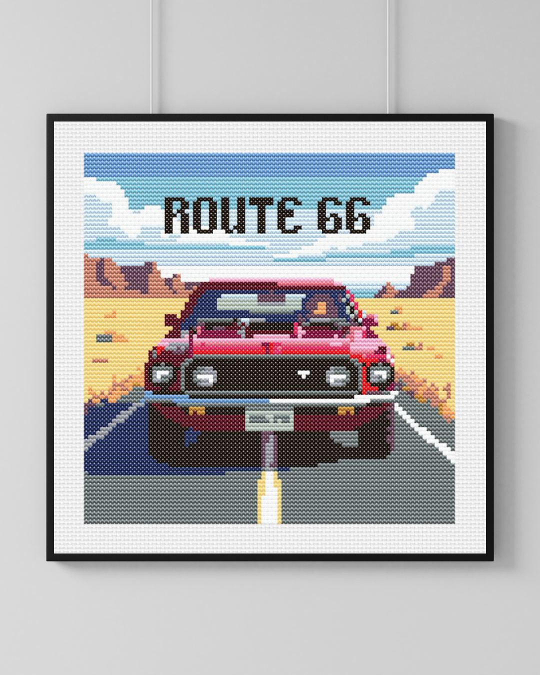 Diseño en punto de cruz de un Ford Mustang Rojo del 1969 en una carretera de desierto con al texto Route 66 encima