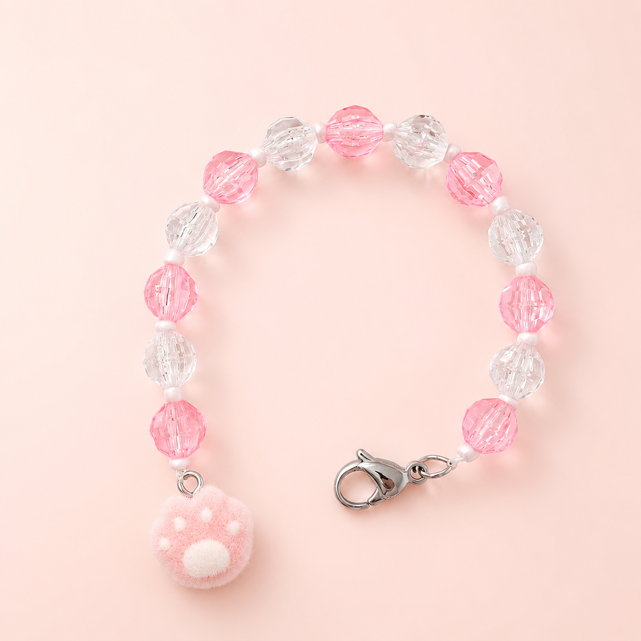 Buscatijeras con abalorios transparentes y rosas con charm de huella de gato rosa para labores de bordado y punto de cruz.