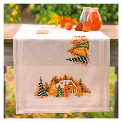 Camino de mesa en punto de cruz Vervaco Pueblo Invernal con paisaje bordado sobre tela de algodón preacabada.