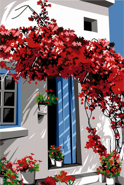 Cañamazo impreso para medio punto Bougainvillier de SEG de Paris con fachada blanca, puerta azul y buganvilla roja en flor.