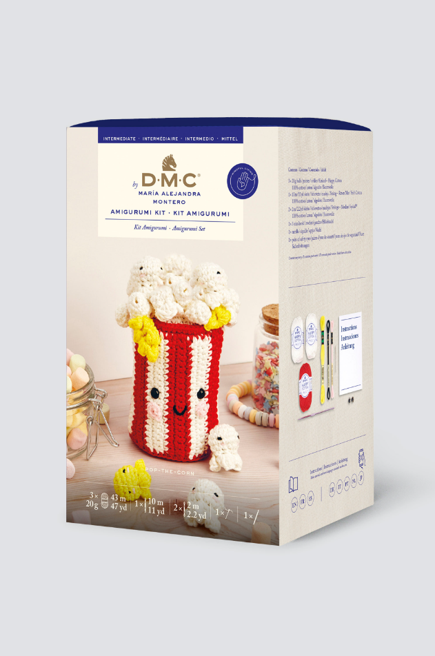 Kit de Amigurumi de DMC para tejer un bol de palomitas kawaii, incluye hilos de algodón, ganchillo y ojitos de seguridad.