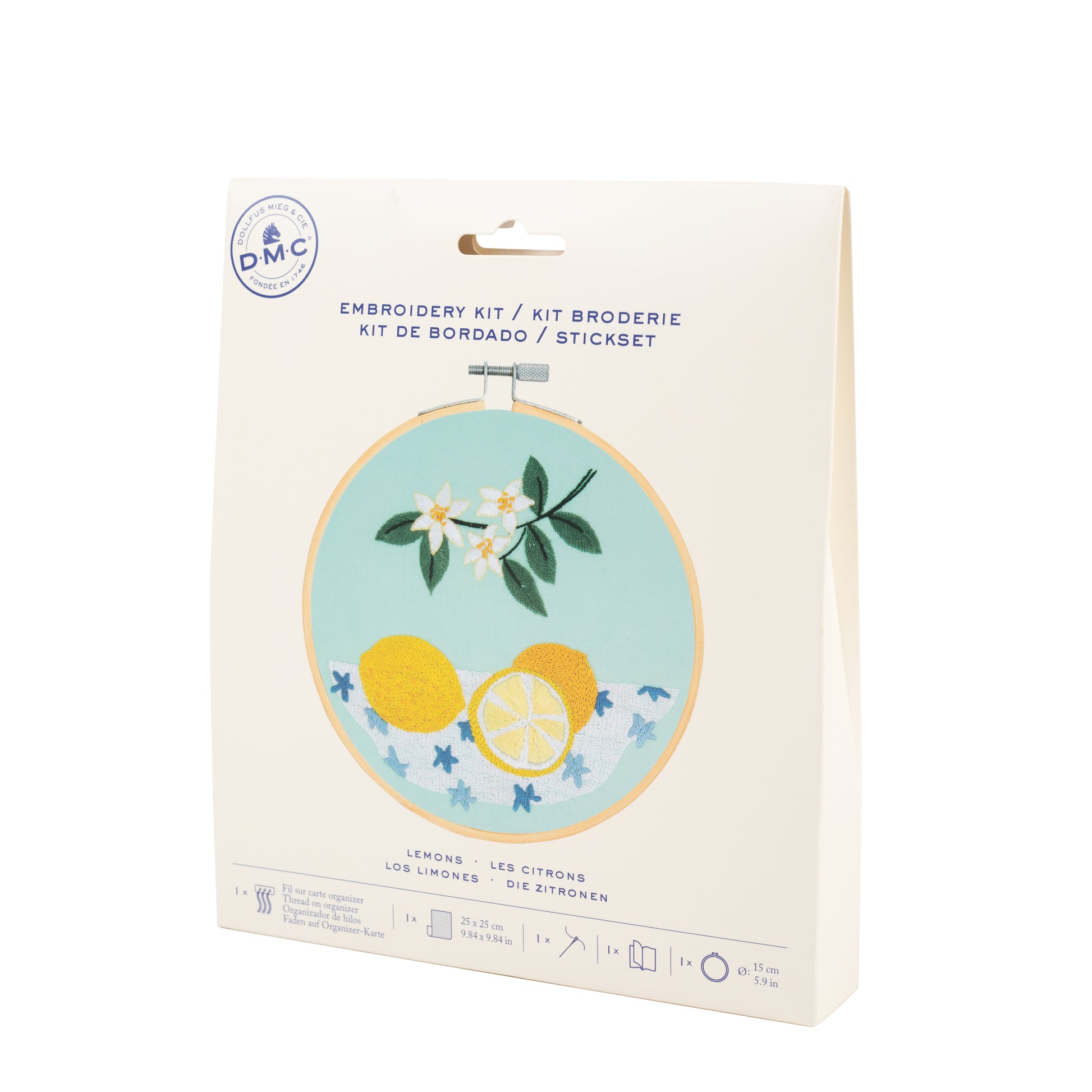 Kit de bordado DMC Los Limones con diseño de limones y flores sobre tela turquesa y packaging de cartón