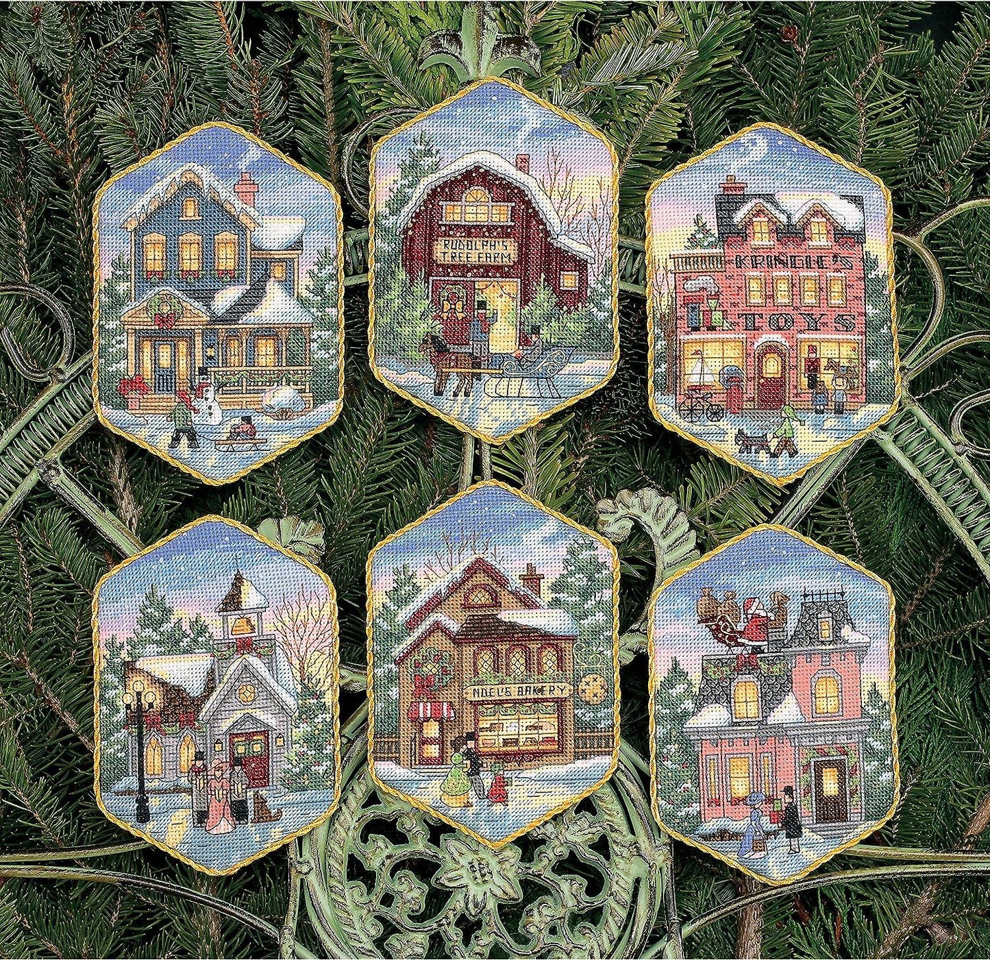Kit para crear adornos de navidad en punto de cruz de Dimensions con diseño de poblado navideño