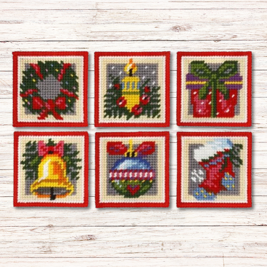 Kit de medio punto navideño de Orchidea Zweigart para bordar 6 posavasos en plastic canvas de 7ct. Diseños festivos y duraderos, ideales para decorar y proteger la mesa en Navidad.