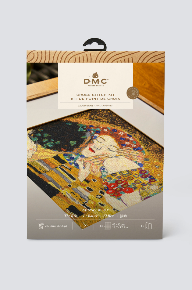 Kit de punto de cruz "El Beso" de Gustav Klimt de DMC, diseño icónico con detalles dorados y patrones geométricos, ideal para bordar una obra maestra del modernismo.