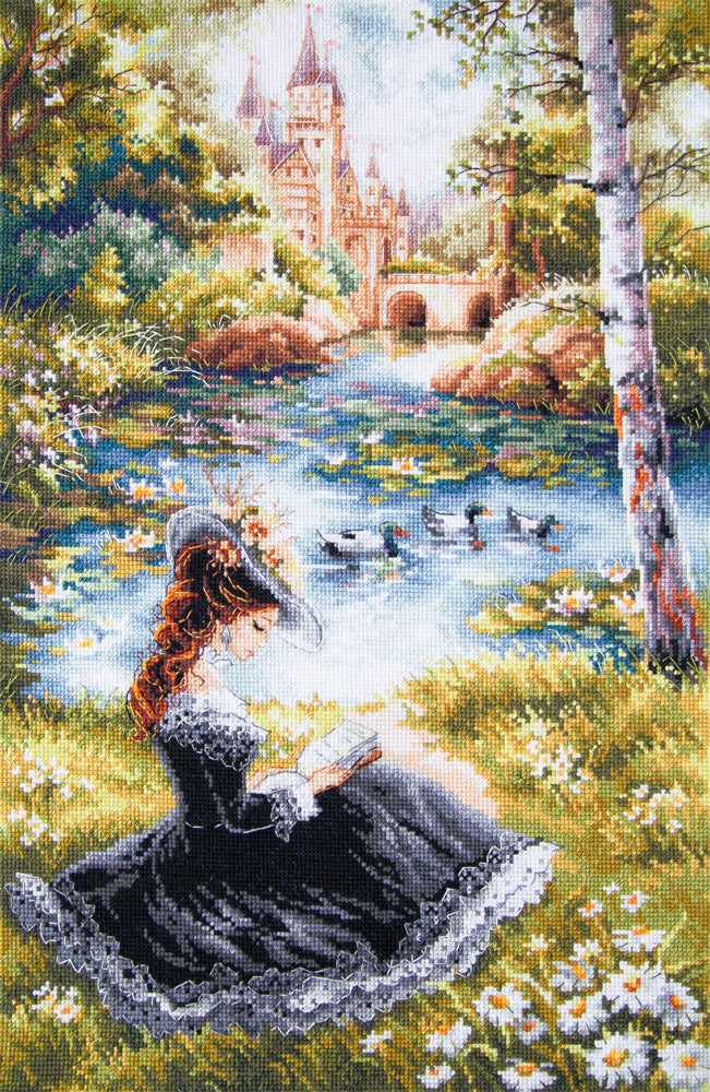 Kit de punto de cruz Magic Needle Romantic Novel con joven leyendo junto a un estanque y castillo al fondo