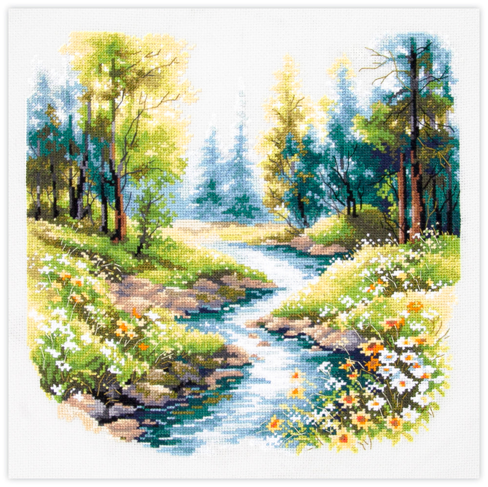 Kit de punto de cruz Magic Needle "Sounds of Nature" con diseño de río en bosque verde con flores blancas y amarillas para bordado artesanal.