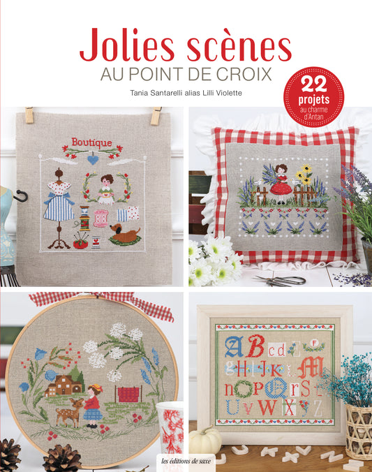 Portada del libro “Jolies scènes au point de croix” de Lilli Violette (Les Éditions de Saxe) con 22 proyectos: boutique, cojín floral, escena campestre y abecedario bordado.