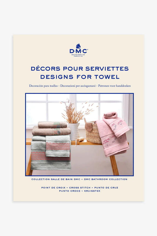 Libro de punto de cruz DMC motivos para toallas con diseños bordados en textiles de baño como flores y cenefas.