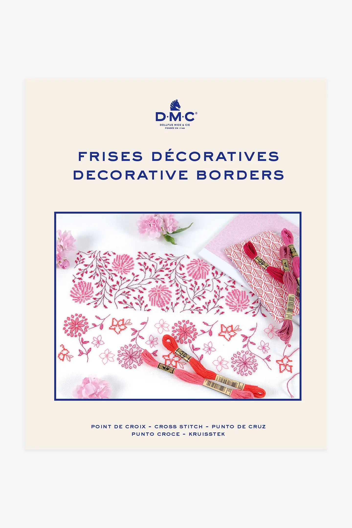 Mini libro de punto de cruz DMC cenefas con patrones de bordes florales repetitivos para decoración textil.