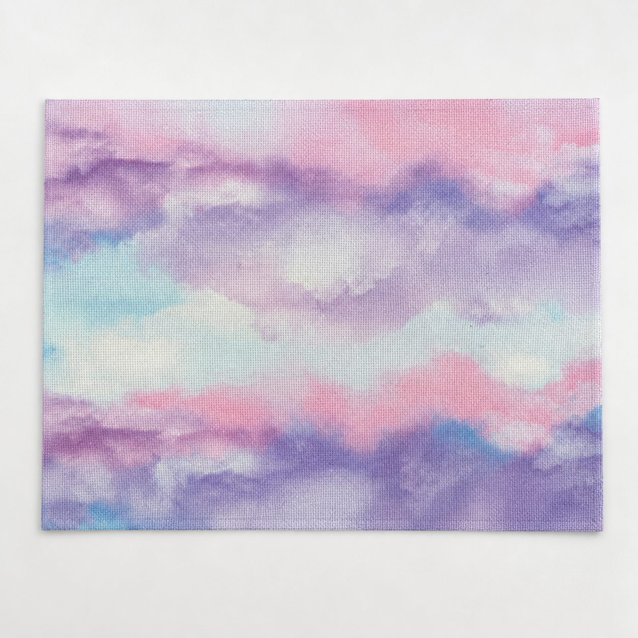 Tela Aida impresa precortada Acuarela Pastel de Loisirs Créatifs en formato 30x40 cm con estampado multicolor en tonos rosa, lila, azul y turquesa.